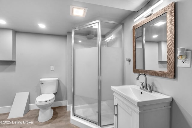 7007 Graymoor Rd, Louisville, KY 40222 - full bathroom with toilet, a shower stall, vanity, wood finished floors, and baseboards