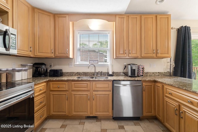 1421 W Elm Rd, Radcliff, KY 40160 - kitchen featuring appliances with stainless steel finishes, a sink, and light stone counters