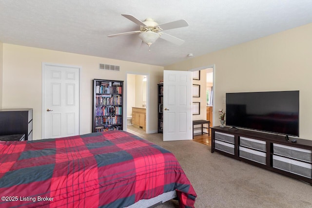 1421 W Elm Rd, Radcliff, KY 40160 - carpeted bedroom featuring connected bathroom and ceiling fan