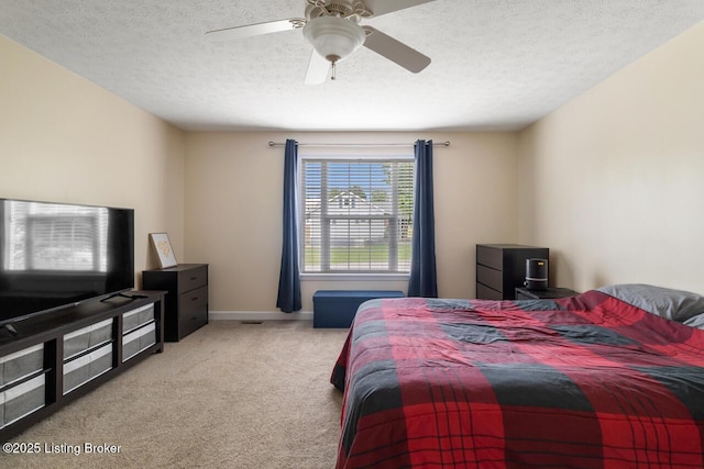 1421 W Elm Rd, Radcliff, KY 40160 - bedroom with carpet floors, a textured ceiling, a ceiling fan, and baseboards