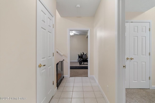 1421 W Elm Rd, Radcliff, KY 40160 - hall featuring light carpet, baseboards, and light tile patterned flooring