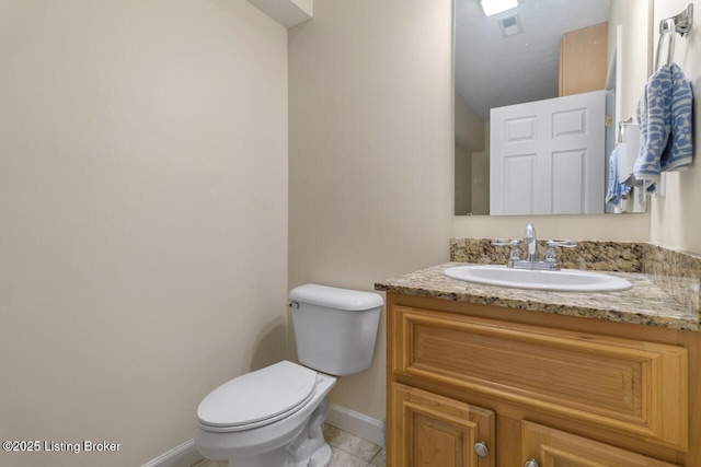 1421 W Elm Rd, Radcliff, KY 40160 - half bathroom featuring toilet, vanity, baseboards, and tile patterned floors