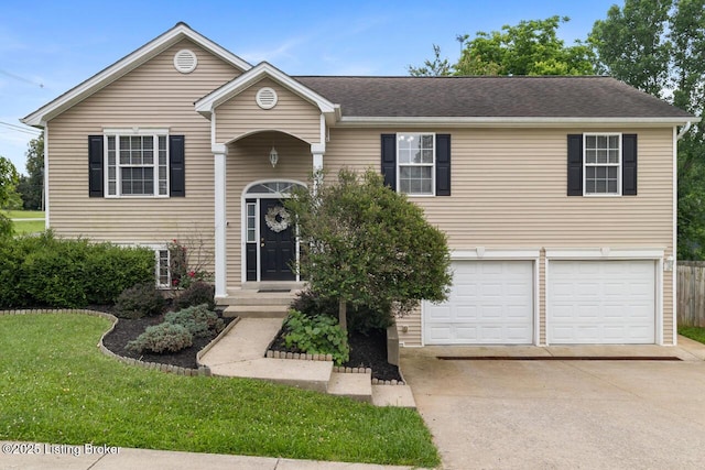1421 W Elm Rd, Radcliff, KY 40160 - view of front of house with driveway, an attached garage, and a front lawn