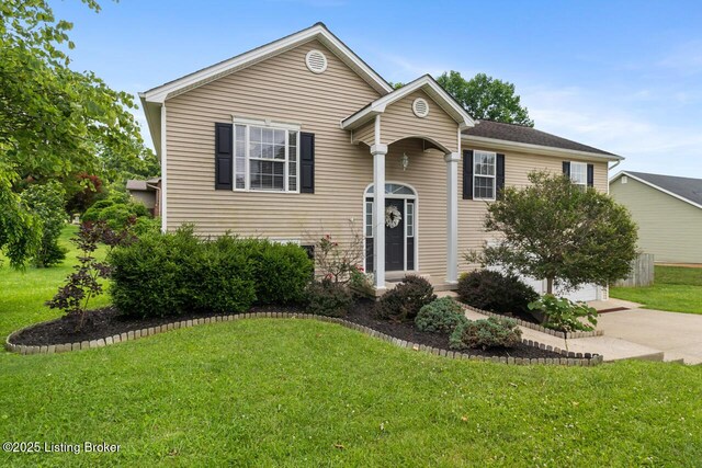 1421 W Elm Rd, Radcliff, KY 40160 - raised ranch with a front lawn and driveway