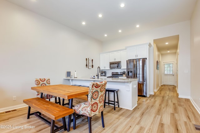 421 Marret Ave, Louisville, KY 40208 - dining room with light wood-style floors, recessed lighting, and baseboards