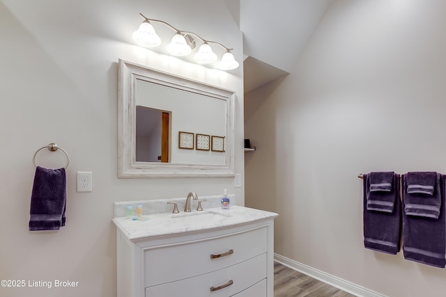 421 Marret Ave, Louisville, KY 40208 - bathroom featuring vanity, wood finished floors, and baseboards