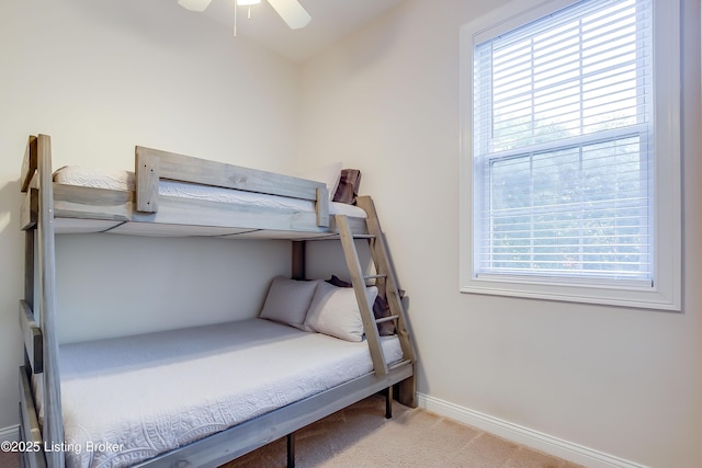 421 Marret Ave, Louisville, KY 40208 - carpeted bedroom featuring multiple windows, baseboards, and a ceiling fan