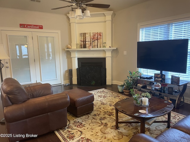 6008 Cottage Ln, Crestwood, KY 40014 - living area featuring a ceiling fan, wood finished floors, a fireplace with flush hearth, and baseboards
