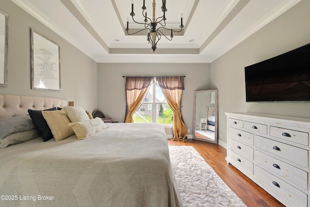 7811 Ingram Way, Crestwood, KY 40014 - bedroom with a tray ceiling, a chandelier, light wood-style floors, and crown molding
