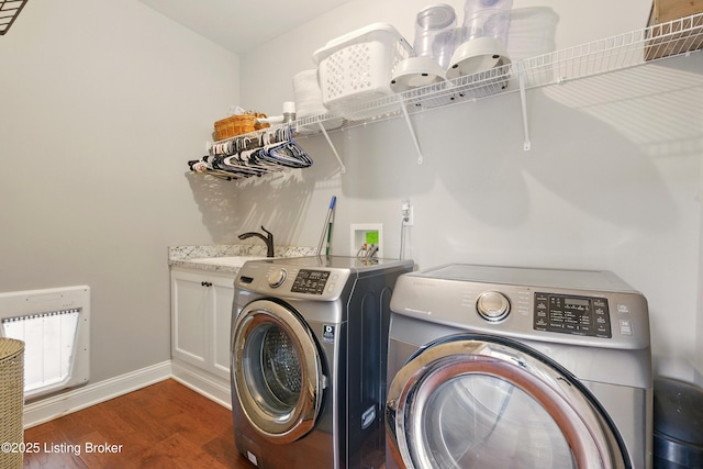 7811 Ingram Way, Crestwood, KY 40014 - laundry room featuring washing machine and dryer, wood finished floors, baseboards, cabinet space, and heating unit