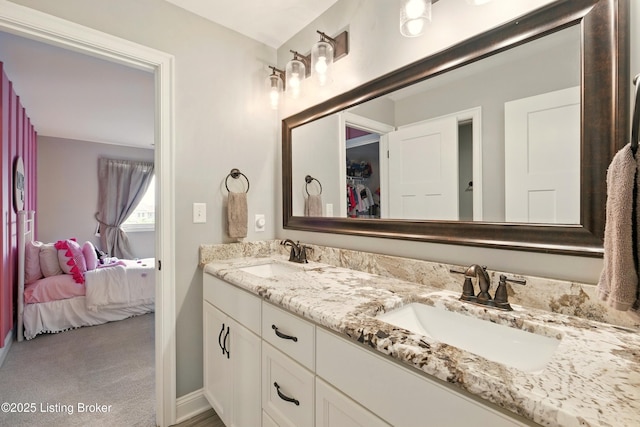 7811 Ingram Way, Crestwood, KY 40014 - bathroom with double vanity, connected bathroom, baseboards, and a spacious closet