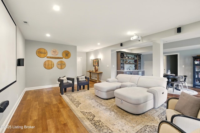 7811 Ingram Way, Crestwood, KY 40014 - living area with wet bar, wood finished floors, baseboards, and recessed lighting