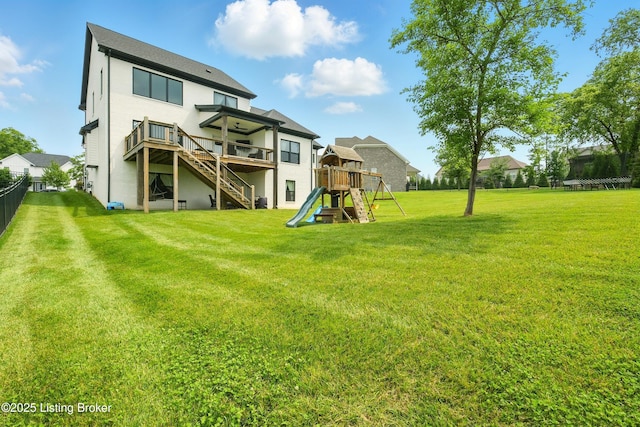 7811 Ingram Way, Crestwood, KY 40014 - rear view of house with a playground, stairs, a wooden deck, and stucco siding