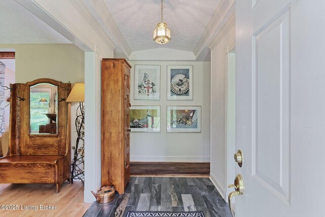 6311 Fible Ln, Crestwood, KY 40014 - foyer entrance featuring a textured ceiling, ornamental molding, wood finished floors, baseboards, and vaulted ceiling