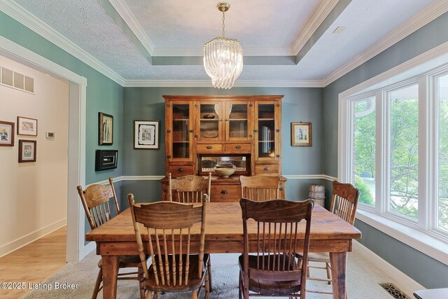 6311 Fible Ln, Crestwood, KY 40014 - dining room with a chandelier, baseboards, a tray ceiling, ornamental molding, and light colored carpet