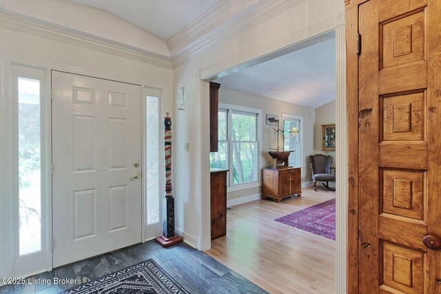 6311 Fible Ln, Crestwood, KY 40014 - foyer entrance with lofted ceiling, dark wood finished floors, baseboards, and ornamental molding