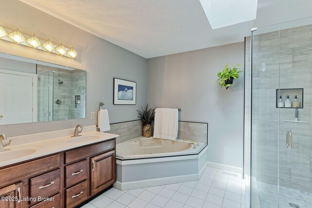 6311 Fible Ln, Crestwood, KY 40014 - bathroom with tile patterned flooring, a shower stall, double vanity, a garden tub, and a textured ceiling