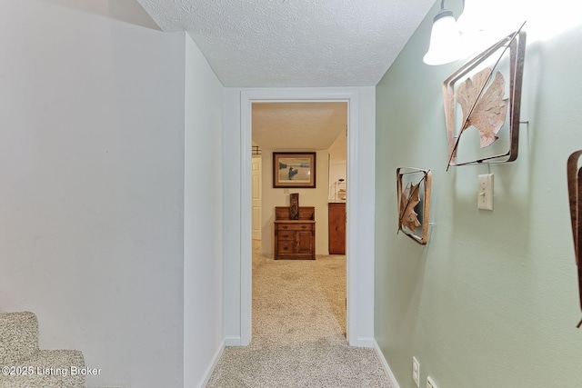 6311 Fible Ln, Crestwood, KY 40014 - hallway with a textured ceiling, light colored carpet, and baseboards