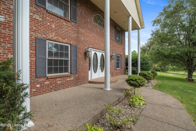 622 Hillcreek Dr, Elizabethtown, KY 42701 - doorway to property featuring brick siding and a yard