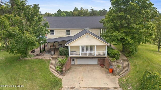 622 Hillcreek Dr, Elizabethtown, KY 42701 - view of front of house featuring a front yard, covered porch, a garage, and driveway