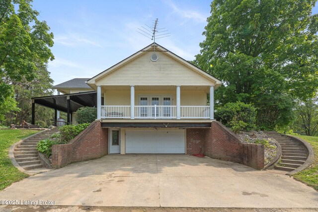 622 Hillcreek Dr, Elizabethtown, KY 42701 - view of front of property with stairway, a garage, a porch, and concrete driveway
