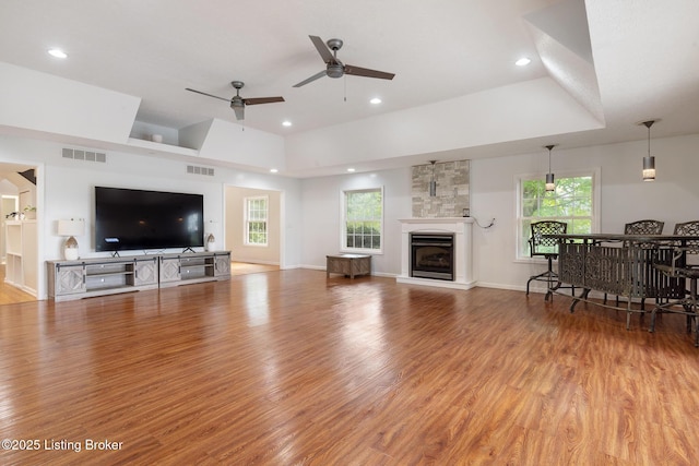 622 Hillcreek Dr, Elizabethtown, KY 42701 - living area with a raised ceiling, a ceiling fan, light wood-style flooring, a fireplace, and recessed lighting