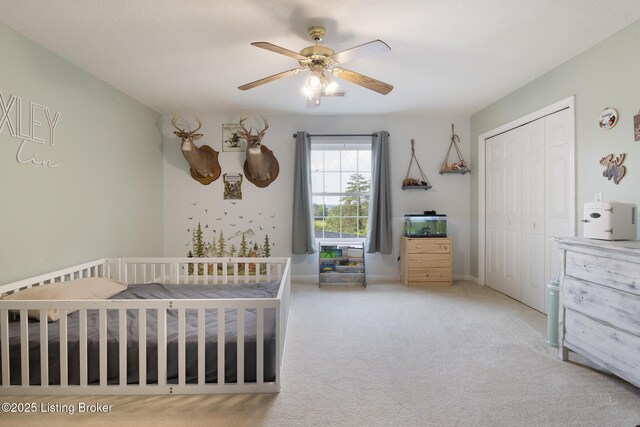622 Hillcreek Dr, Elizabethtown, KY 42701 - bedroom featuring a closet, carpet, a crib, a ceiling fan, and baseboards