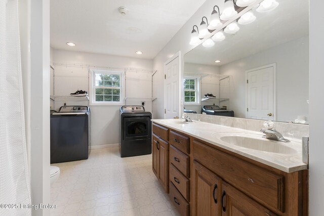 622 Hillcreek Dr, Elizabethtown, KY 42701 - full bath featuring independent washer and dryer, double vanity, toilet, tile patterned floors, and recessed lighting