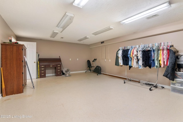 622 Hillcreek Dr, Elizabethtown, KY 42701 - exercise area featuring baseboards and a textured ceiling