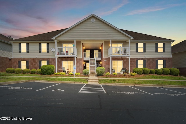 165 Central Blvd Apt 51, Mt Washington, KY 40047 - property at dusk featuring uncovered parking and stairway