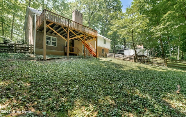 211 Rebel Dr, Pewee Valley, KY 40056 - back of property with a deck, a fenced backyard, a chimney, and stairway