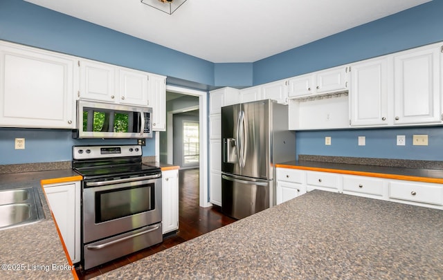 211 Rebel Dr, Pewee Valley, KY 40056 - kitchen featuring stainless steel appliances, dark countertops, white cabinetry, and dark wood-type flooring