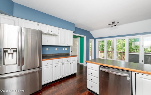 211 Rebel Dr, Pewee Valley, KY 40056 - kitchen featuring appliances with stainless steel finishes, lofted ceiling, dark countertops, dark wood finished floors, and white cabinets