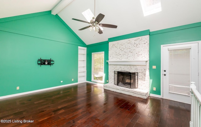211 Rebel Dr, Pewee Valley, KY 40056 - unfurnished living room featuring a fireplace, beamed ceiling, wood finished floors, a ceiling fan, and high vaulted ceiling