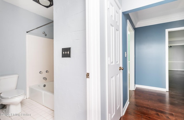 211 Rebel Dr, Pewee Valley, KY 40056 - bathroom featuring tub / shower combination, toilet, hardwood / wood-style flooring, crown molding, and baseboards