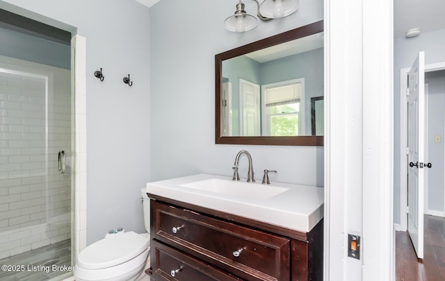 211 Rebel Dr, Pewee Valley, KY 40056 - bathroom with vanity, a shower stall, toilet, and wood finished floors