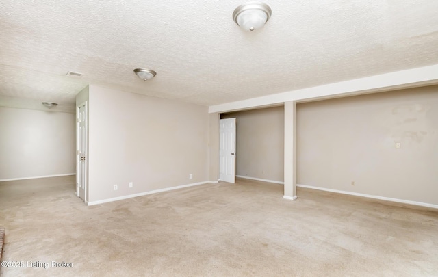 211 Rebel Dr, Pewee Valley, KY 40056 - finished below grade area featuring a textured ceiling, light colored carpet, and baseboards