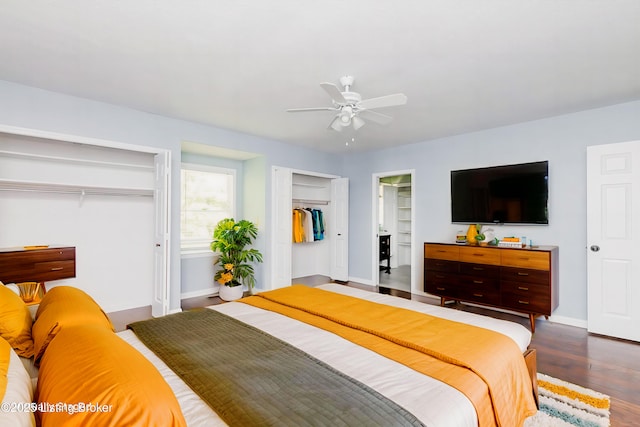 211 Rebel Dr, Pewee Valley, KY 40056 - bedroom featuring baseboards, wood finished floors, ceiling fan, and two closets