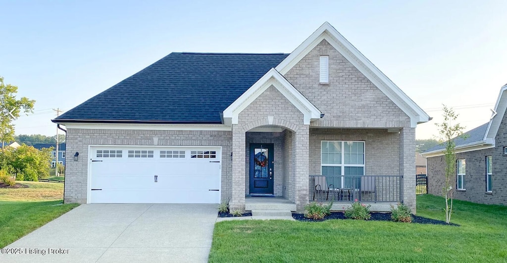 1325 Helm Place Ln, Louisville, KY 40299 - view of front of house featuring a porch, a front yard, driveway, an attached garage, and a shingled roof