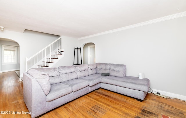 4825 Manslick Rd, Louisville, KY 40216 - living area featuring arched walkways, hardwood / wood-style flooring, stairway, baseboards, and ornamental molding