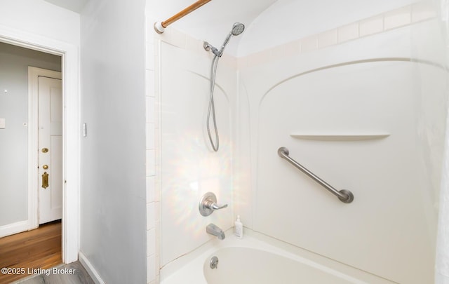4825 Manslick Rd, Louisville, KY 40216 - bathroom with shower / tub combination, wood finished floors, and baseboards