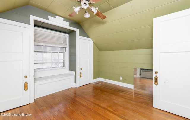 4825 Manslick Rd, Louisville, KY 40216 - bonus room with lofted ceiling, hardwood / wood-style floors, a ceiling fan, and baseboards