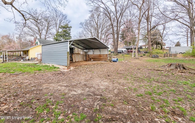 4825 Manslick Rd, Louisville, KY 40216 - view of yard featuring a carport and dirt driveway