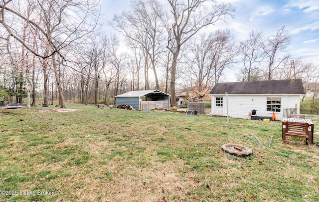 4825 Manslick Rd, Louisville, KY 40216 - view of yard featuring a detached carport and an outdoor structure