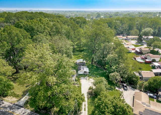 4825 Manslick Rd, Louisville, KY 40216 - aerial view of property's location featuring a heavily wooded area and nearby suburban area