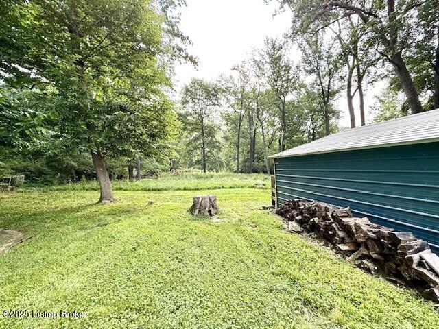 4825 Manslick Rd, Louisville, KY 40216 - view of green lawn with view of wooded area