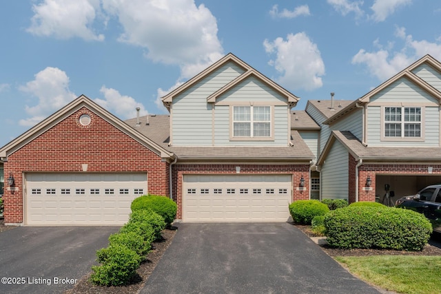 4926 Merton Sq, Louisville, KY 40241 - view of front of house featuring asphalt driveway, brick siding, and a garage