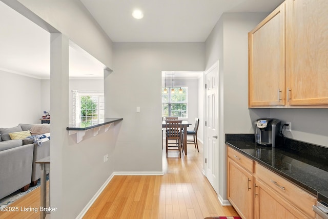 4926 Merton Sq, Louisville, KY 40241 - kitchen with light brown cabinetry, plenty of natural light, light wood-style floors, baseboards, and recessed lighting