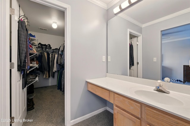 4926 Merton Sq, Louisville, KY 40241 - bathroom featuring vanity, ornamental molding, a walk in closet, and baseboards