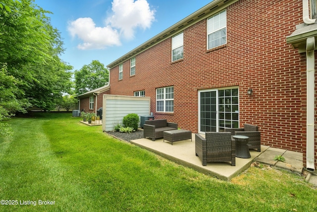 4926 Merton Sq, Louisville, KY 40241 - rear view of property featuring brick siding, cooling unit, a patio, and a lawn
